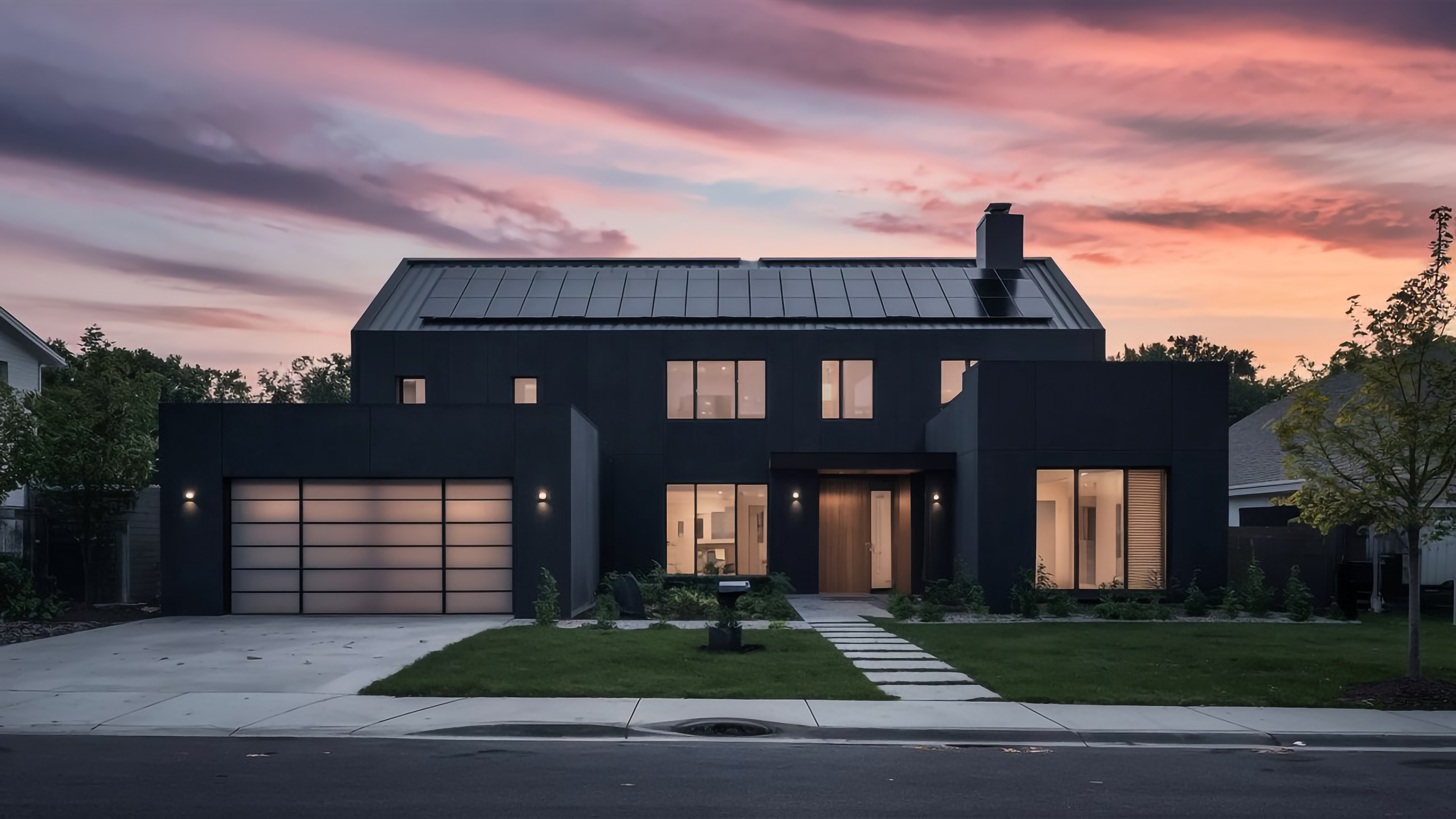 Modern home with solar and battery storage at dusk